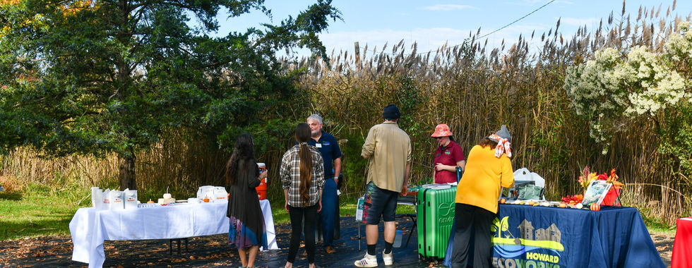 People standing near event tables