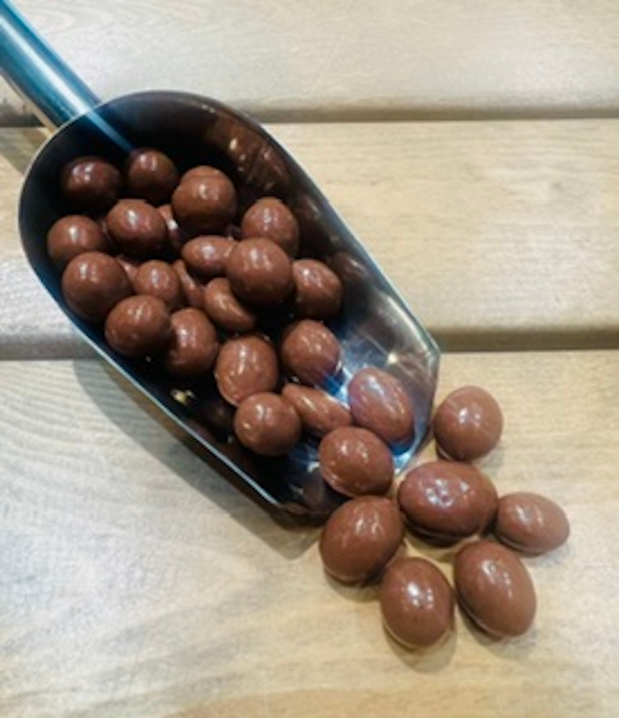 Peanuts coated in Milk Chocolate £3.29/100g