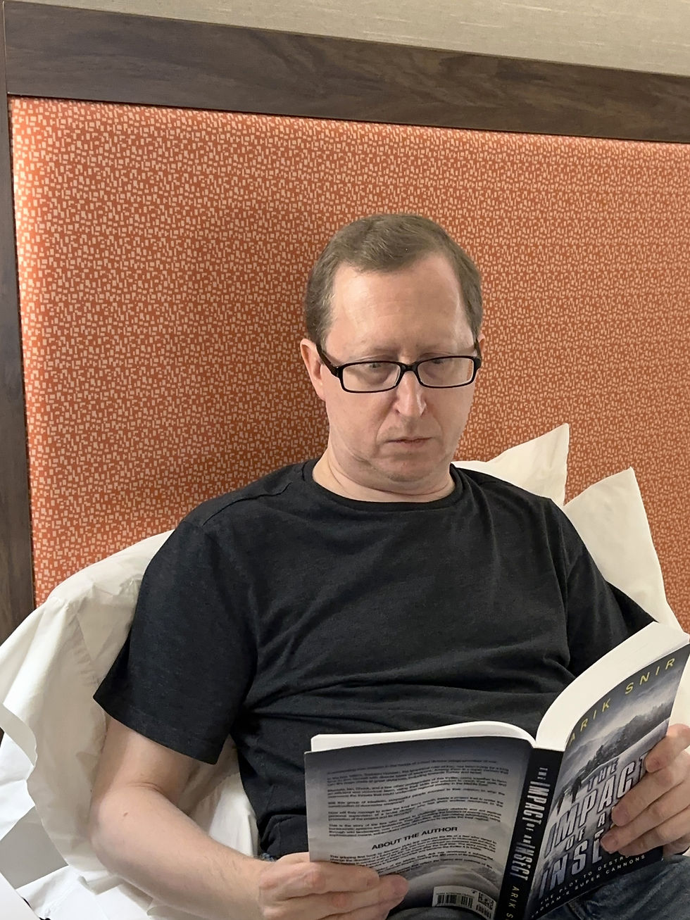 Mark reading a book in the King Studio Suite with a sofabed at the Hampton Inn & Suites in Yonkers, New York