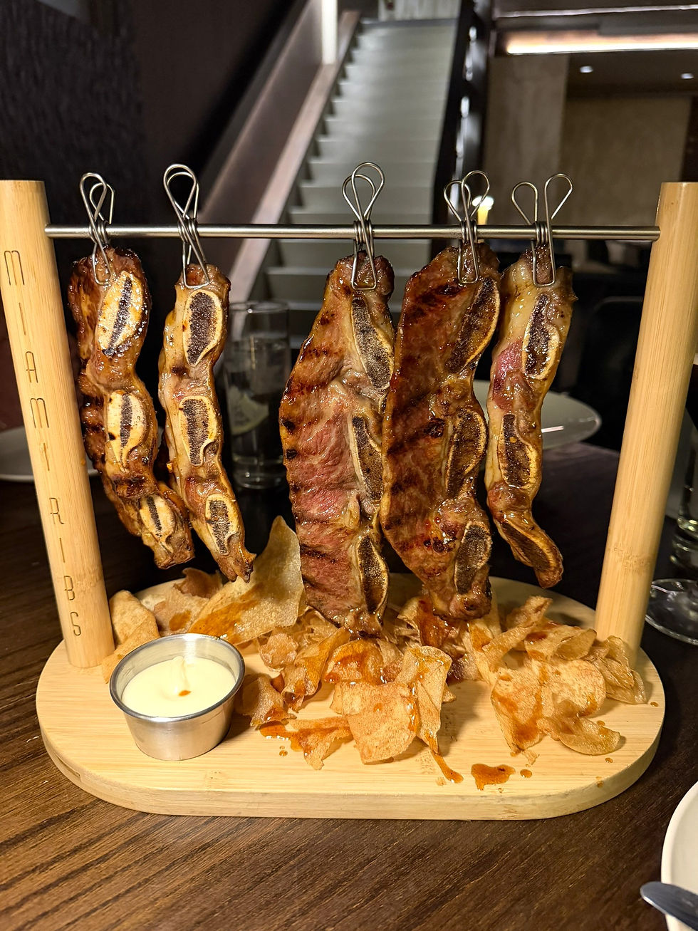 The Miami Ribs served hanging from a custom tabletop rack at Fireside Kosher in Monsey, New York