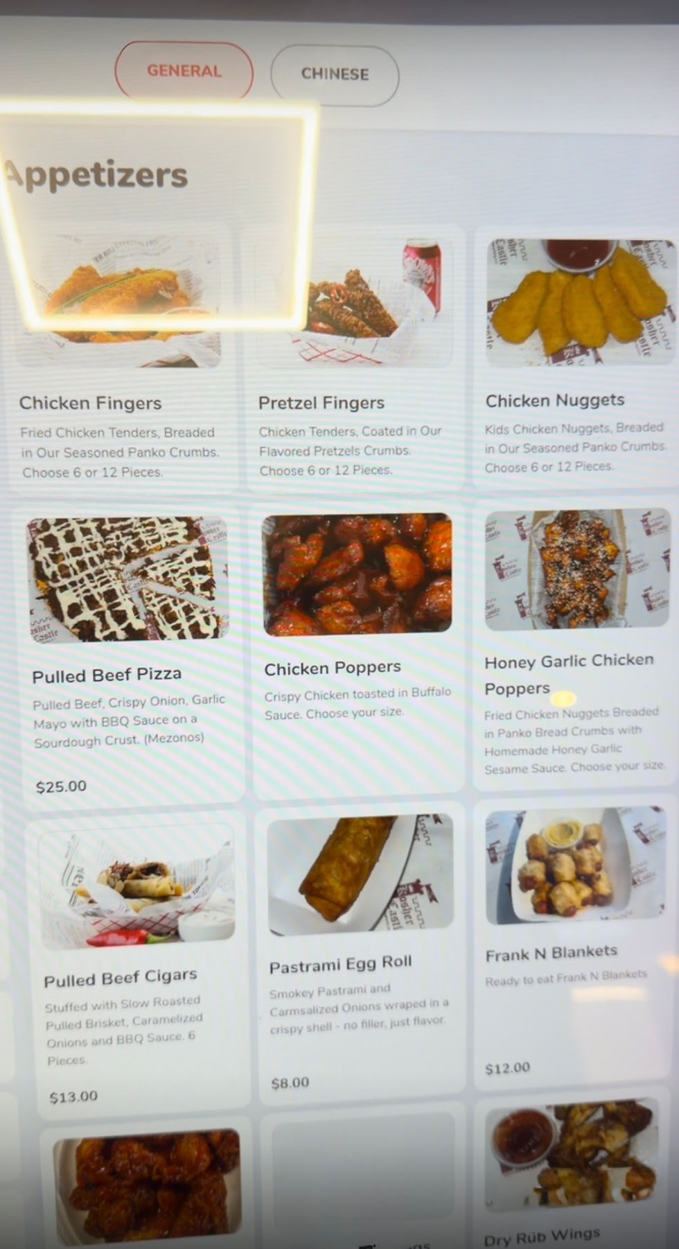 Self-service kiosk screen displaying food choices at Kosher Castle in Monsey, New York