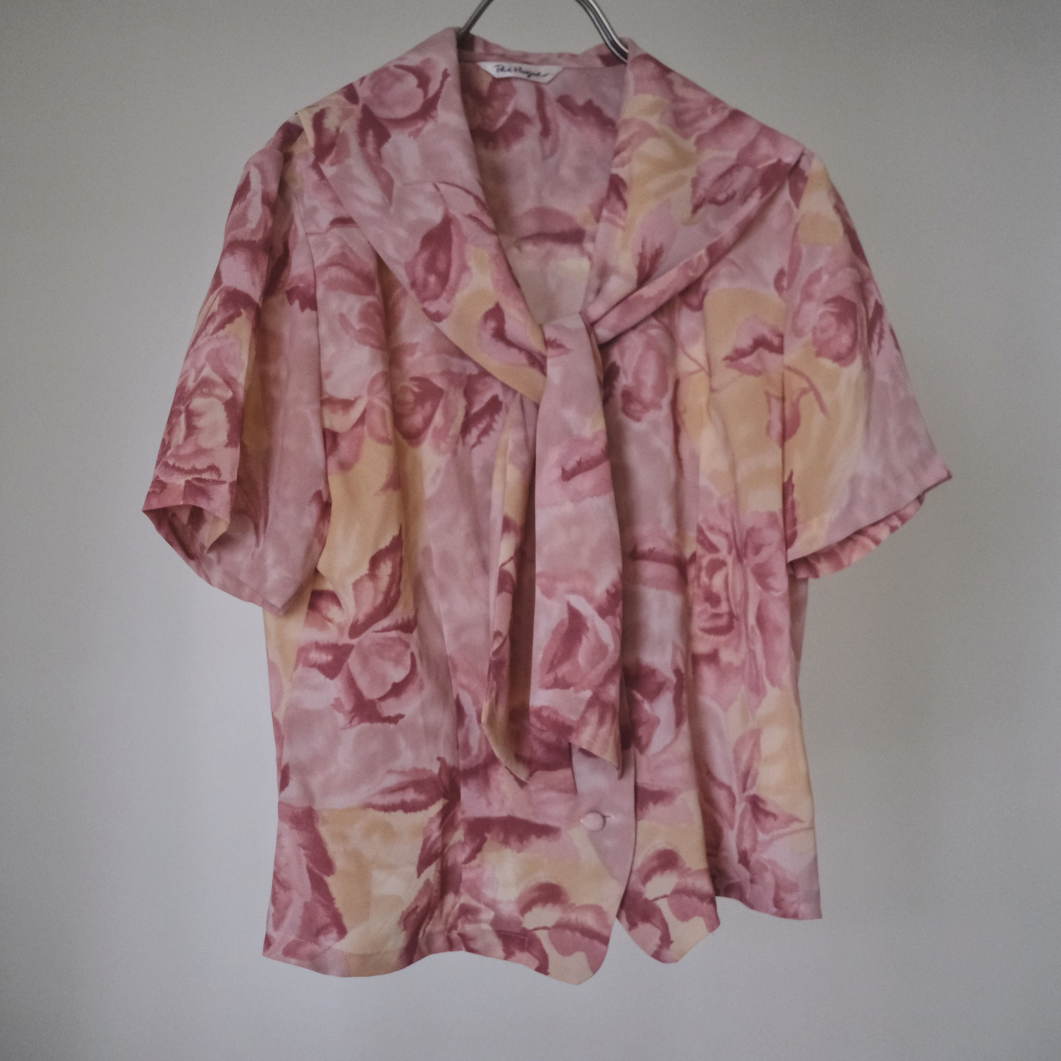 pink floral blouse with tie detail