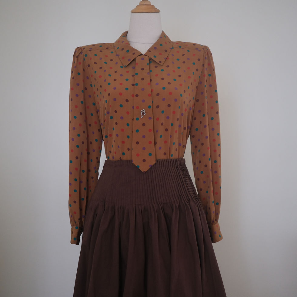 Thumbnail: tan polka dots top