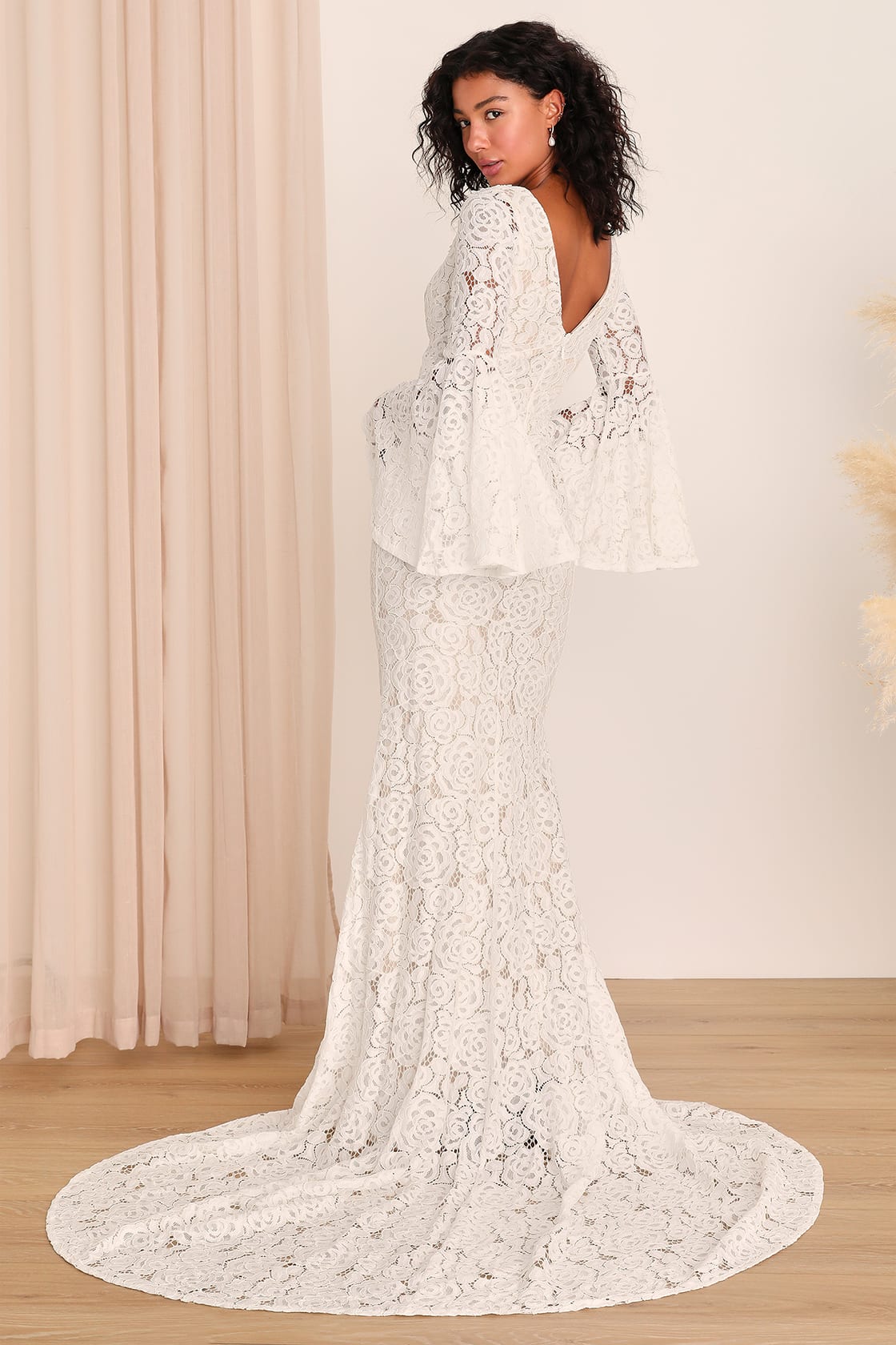 Chic wedding dress with statement sleeves, a bold and fashionable bridal choice by Lulu's