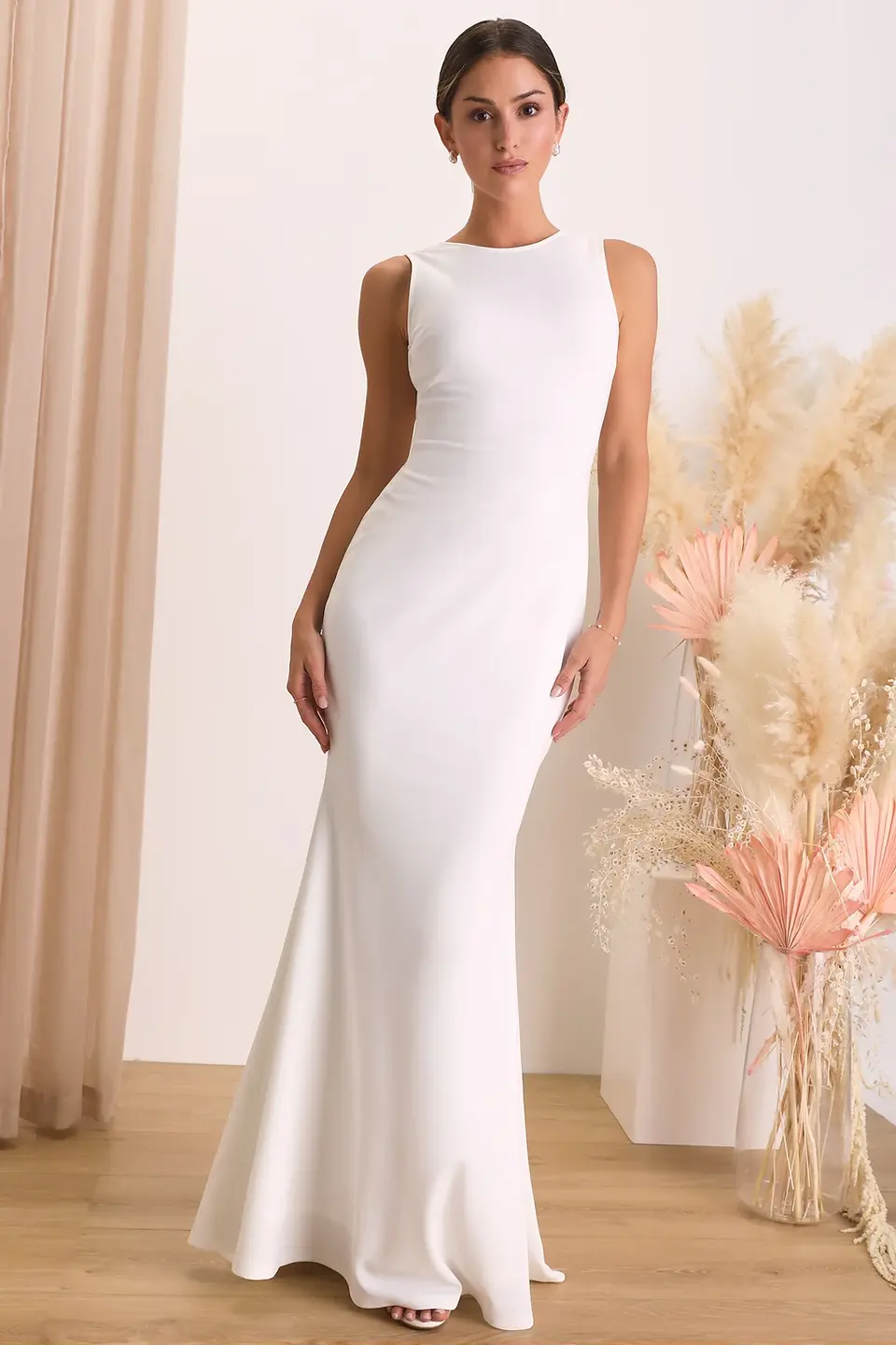 Sleek and minimalist wedding dress by Lulu's, characterized by clean lines and understated elegance