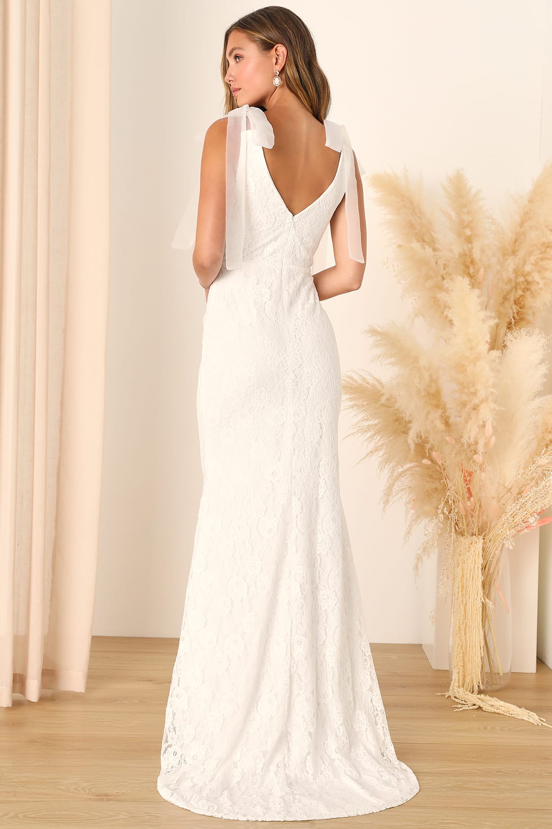 Exquisite wedding dress adorned with timeless lace, a symbol of romance and elegance by Lulu's.