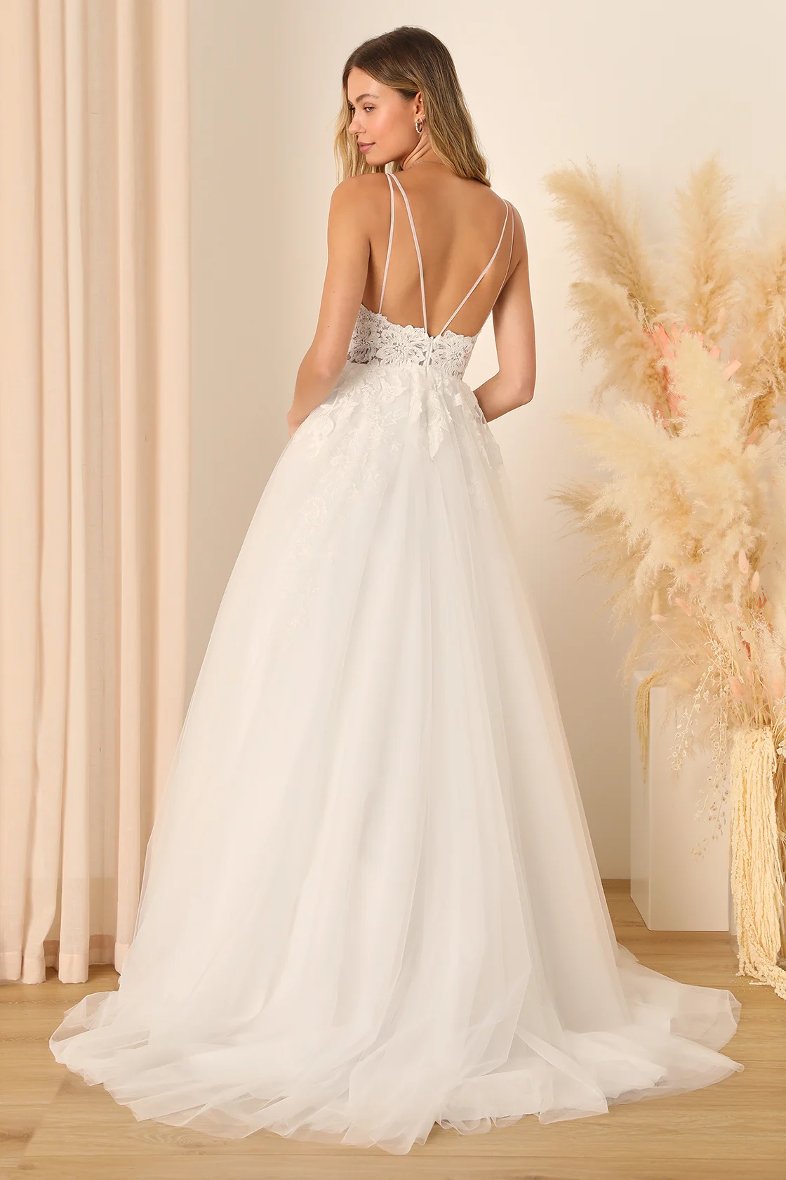Contemporary modern ball gown wedding dress by Lulu's, blending traditional and innovative design elements.