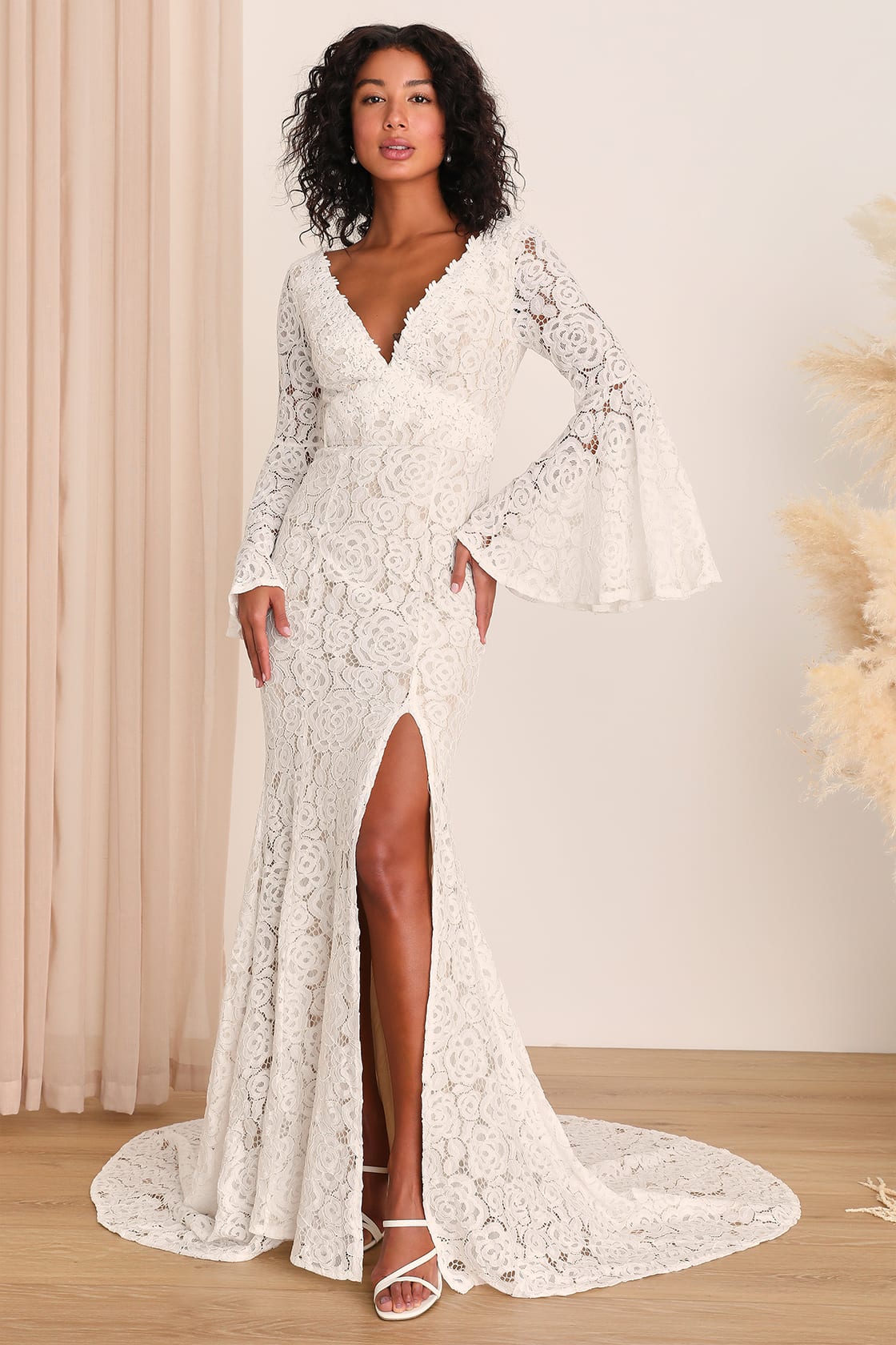 Chic wedding dress with statement sleeves, a bold and fashionable bridal choice by Lulu's