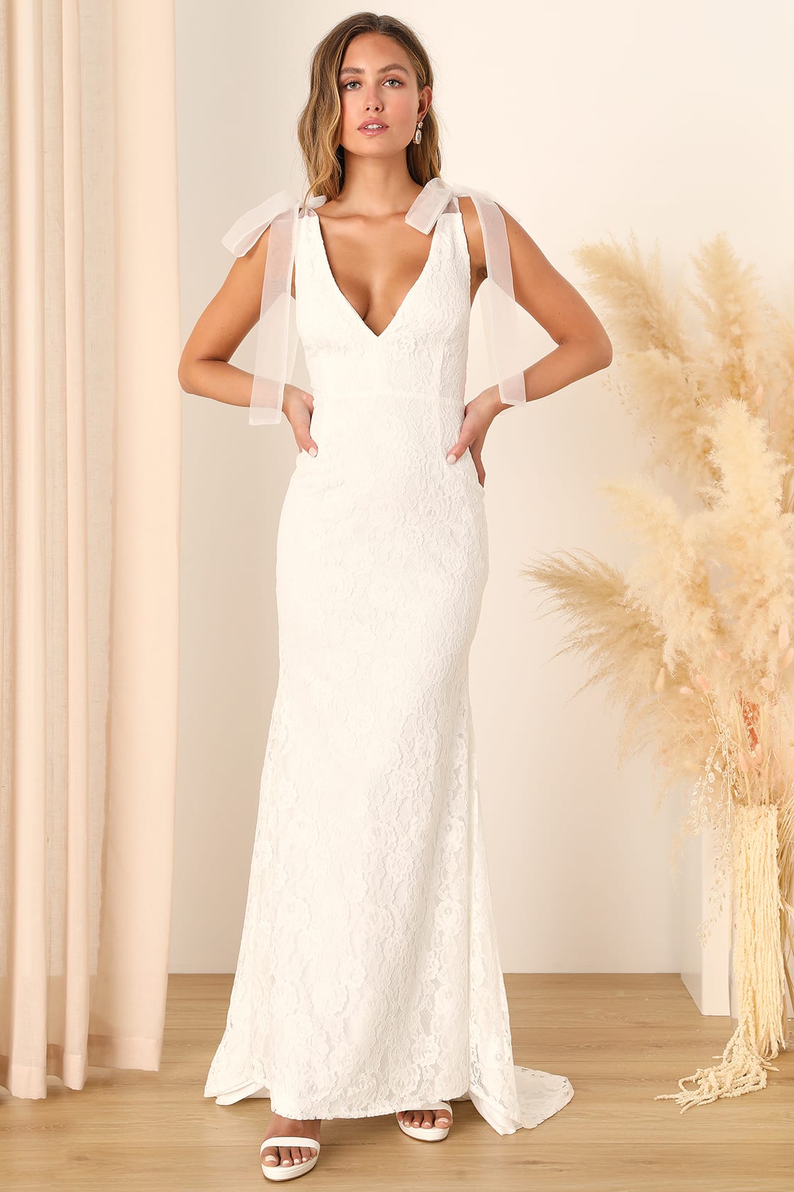 Exquisite wedding dress adorned with timeless lace, a symbol of romance and elegance by Lulu's.