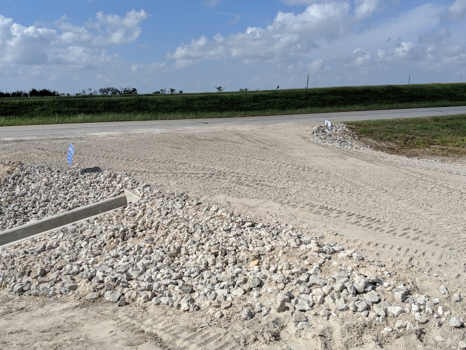 Crushed concrete base above limestone riprap at a culvert