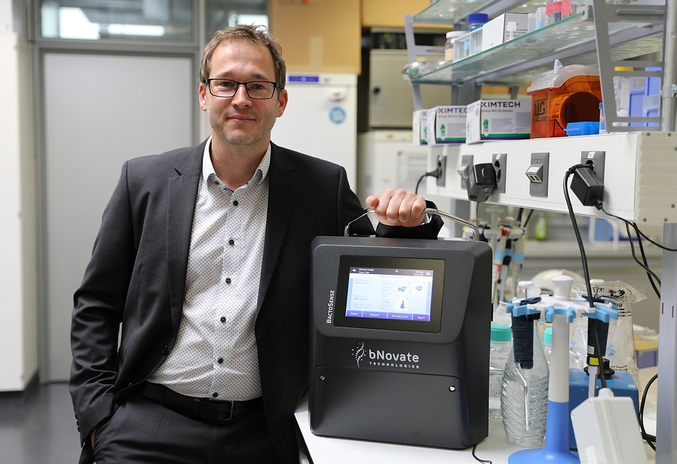 Simon Künzi, CEO R&D and Operations with the BactoSense online water monitoring instrument, in a bNovate laboratory