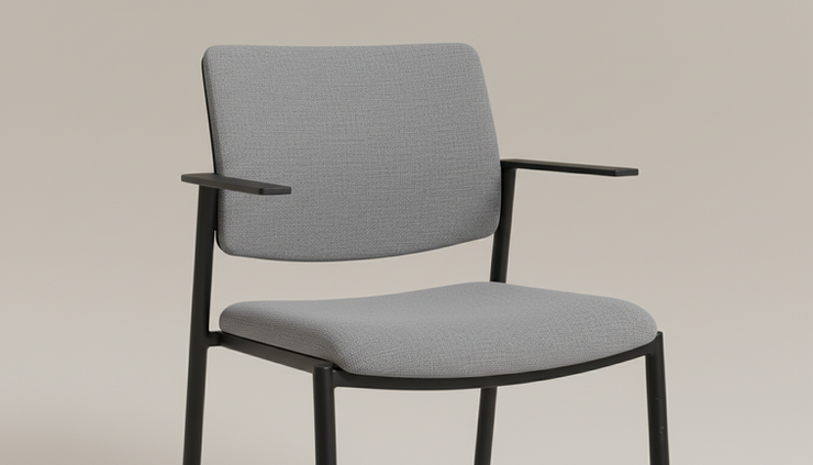 Close-up view of the seat fabric and metal frame on a used visitor chair