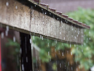 Rain dripping off of a roof