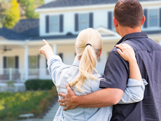 Couple looking at their house