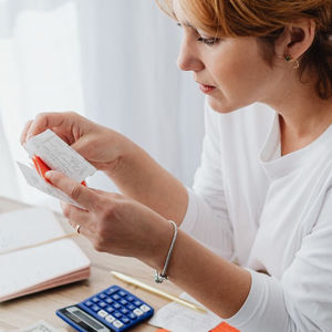 Woman looking at reciept