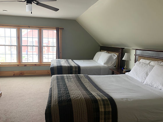 Photos of two queen beds in Room #3