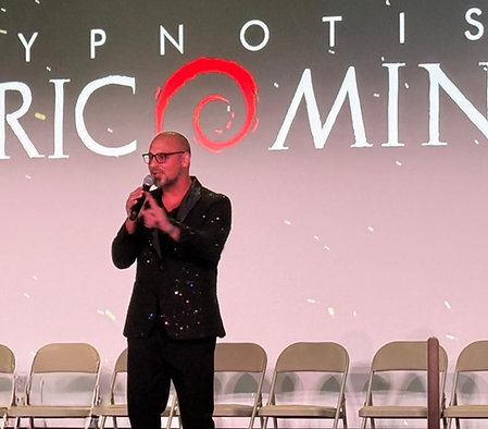 Corporate keynote speaker Eric Mina speaking at a conference event.