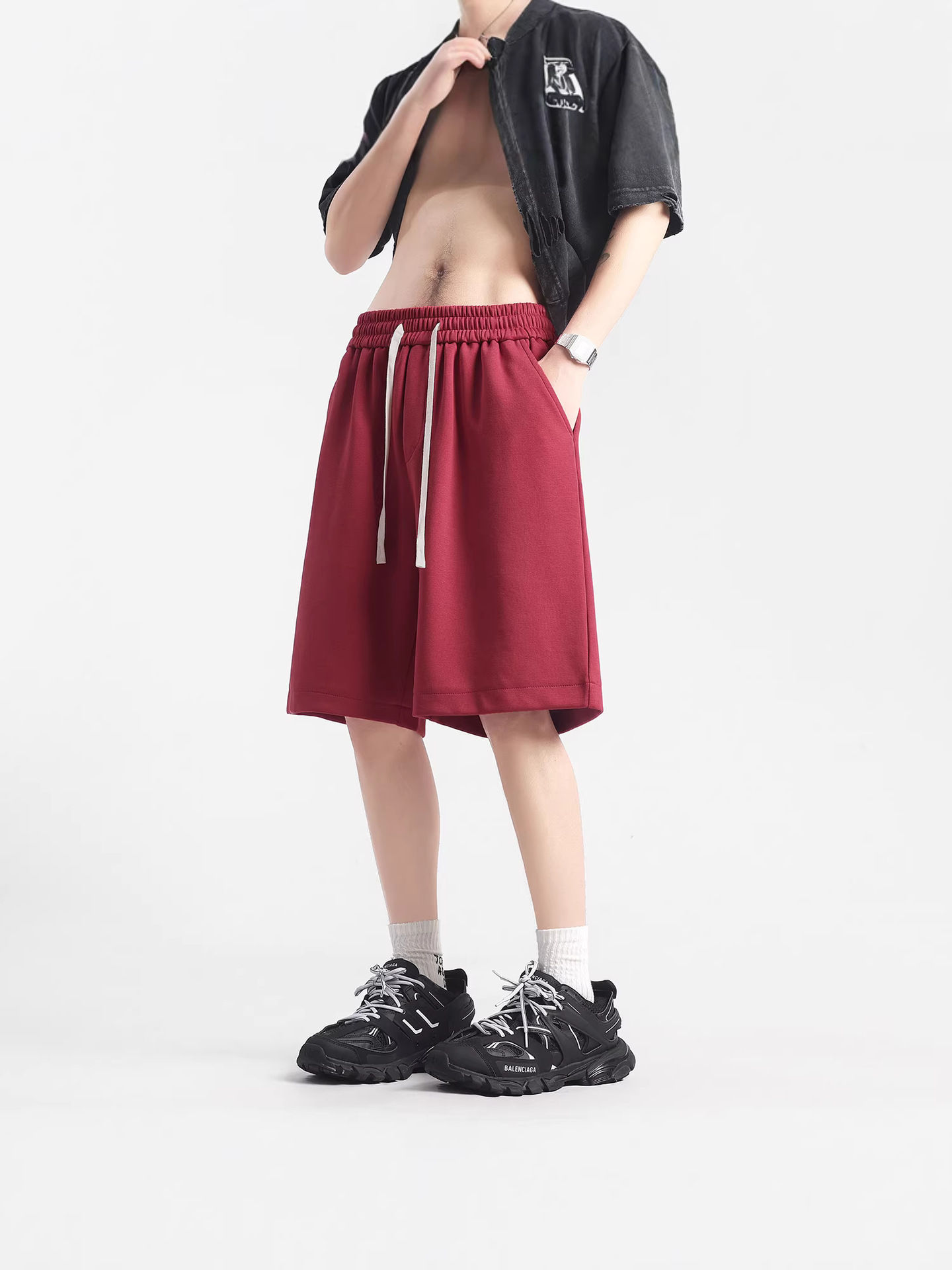 Model wearing Uni-Sex High-Weight Cotton Shorts in red