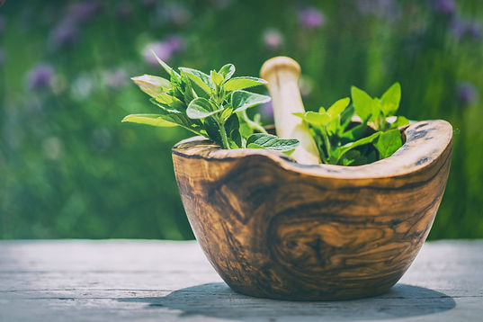 Herbs - Fresh herbs in a mortar.jpg