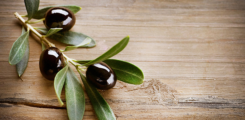 Olives on Wood Background