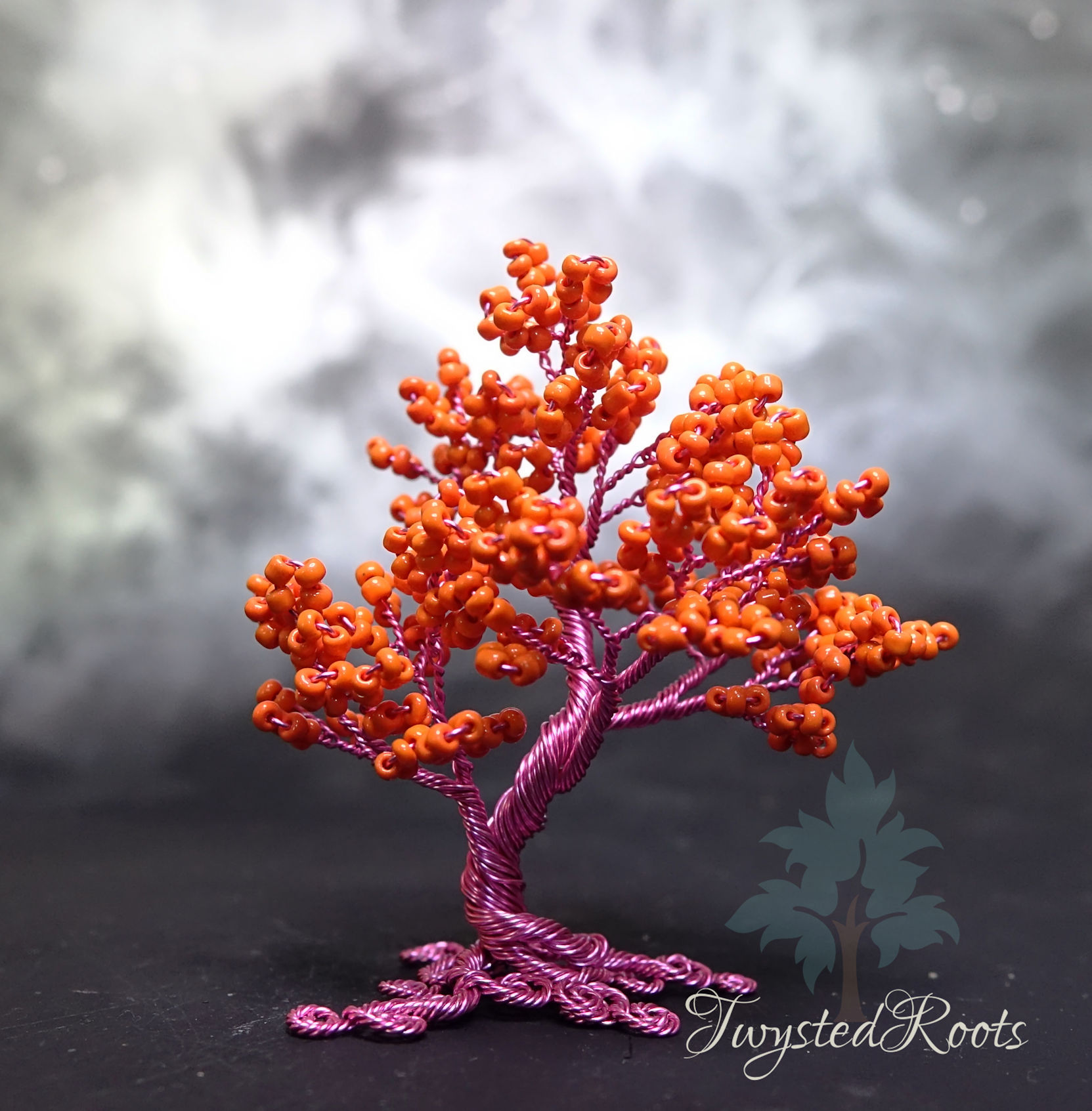 Bright orange bead and pink wire tree sculpture by Twysted Roots