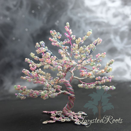 Pastel coloured bead and wire tree sculpture in cream, pink and blue