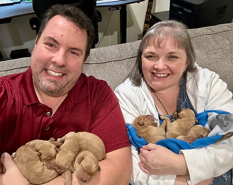 The founders holding their new litter of pups