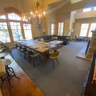 upscale dining room view of our Air BnB, with 10 seats and place settings.