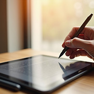 pen writing on tablet