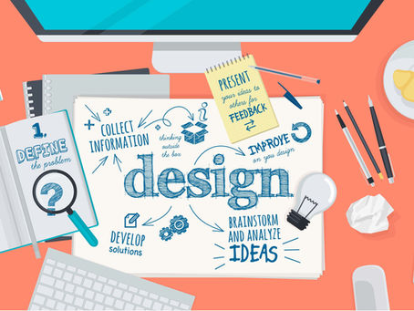 note with sketch of the words design laid out on a table with other objects