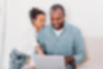 african-american-daughter-showing-something-on-lap-2023-11-27-05-00-46-utc.jpg