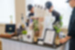 Baristas serving coffee at a mobile espresso bar by Fiesta Espresso Bar