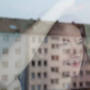 Woman Looking Out the Window