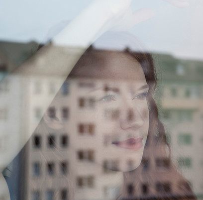 Woman Looking Out the Window