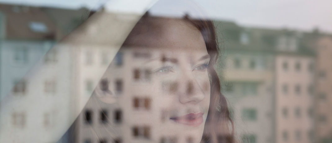 Woman Looking Out the Window