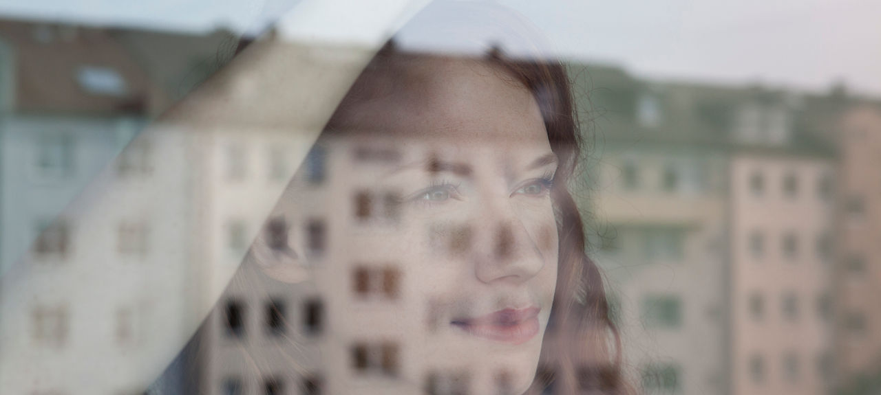 Woman Looking Out the Window