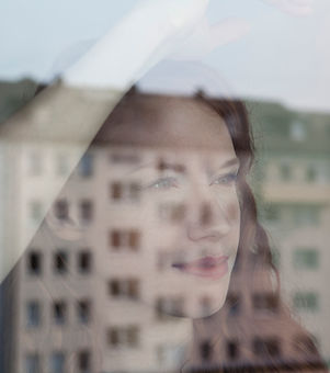 Woman Looking Out the Window