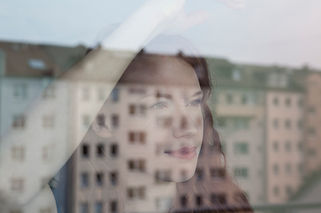 Woman Looking Out the Window