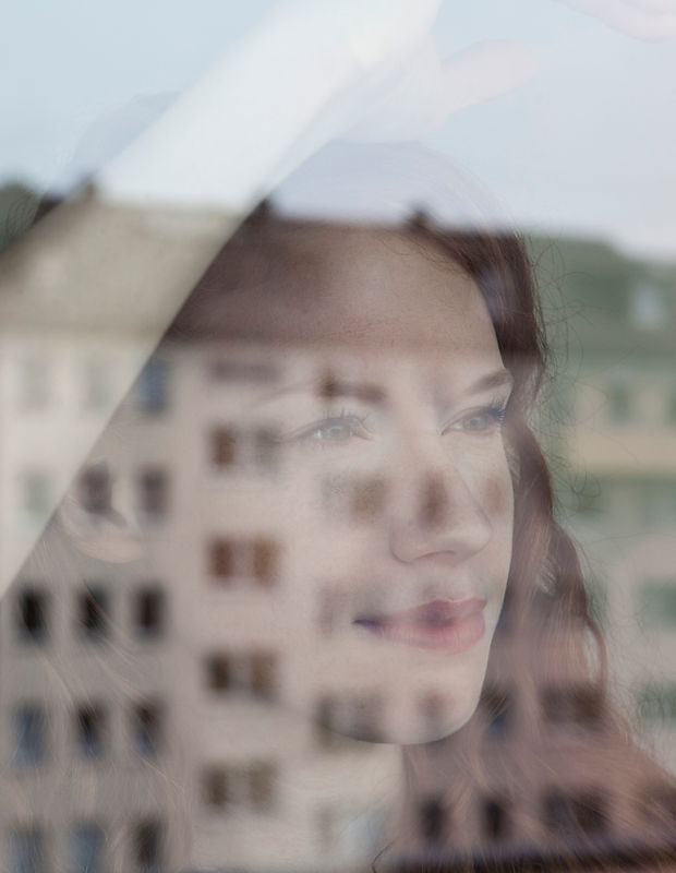 Woman Looking Out the Window