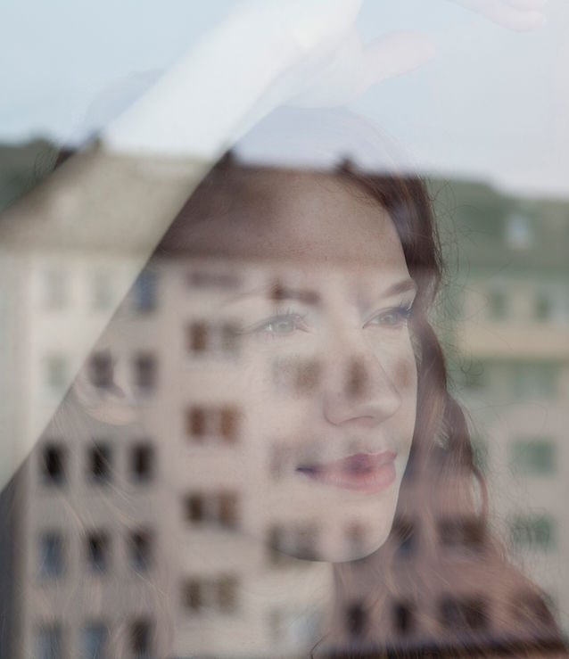 Woman Looking Out the Window