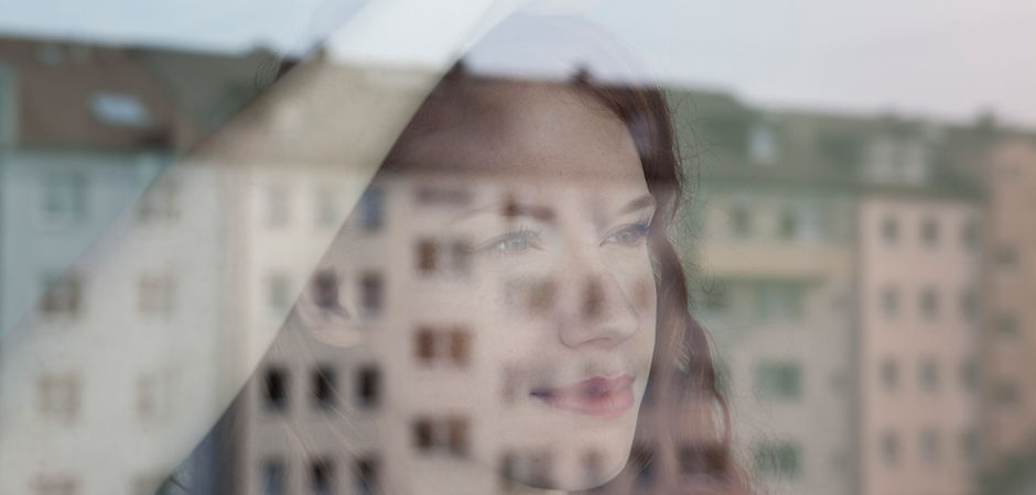 Woman Looking Out the Window