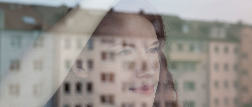 Woman Looking Out the Window