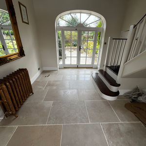Limestone floor with staggered joints at front entrance to a home in Buckingham
