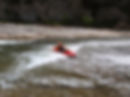 Kate surfing a wave