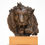 Thumbnail: Diverse sculpture representation, front view of a male lion sculpture with a paw.