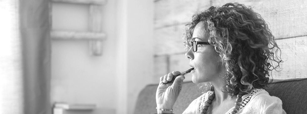 A woman business owner considering her business finances