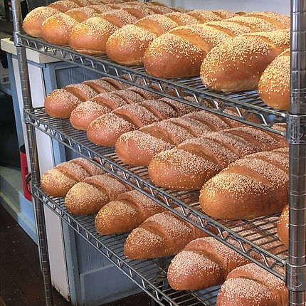 Smiling Pelican bread on racks.jpeg