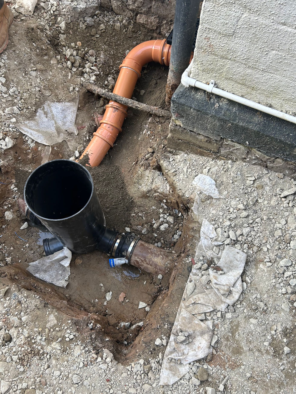 a black pipe is connected to a red pipe