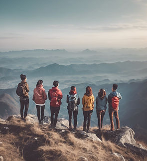 group of people happy on top of mountain (make it diverse) looking at the horizon.jpg