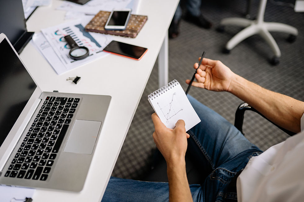 Business professional using digital productivity tools at a laptop